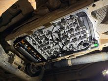 The mechatronics/valve body after all of the ATF has dripped off.