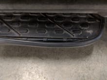 see the rubber is separating from the metal. Without the rubber, that side step/running board is jagged.