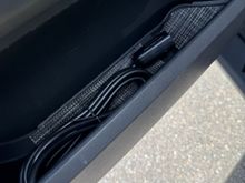 Driver door panel with winch cord. 