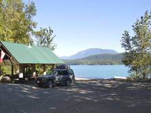 Here is my Disco, it was a 7 seater, the jump seats and 60% seat are removed.    The tent, awning and bars work out to about 150 lbs in total.  Even empty I have no significant body roll.  My off road load is kept below the rear window line.