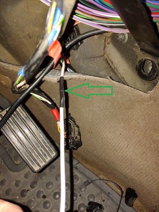 White with pink stripe wire from the window lift ecu.  Had found in spots it had almost melted through all the way to drivers side of the hump.  Not sure if that was because of the scorched wire(melted to bare) or not.