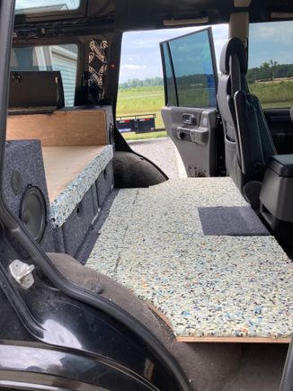 Two layers of padding for the dog bed area. Platform is bolted to rear seat attachment points and supported in front with feet to the floor.  