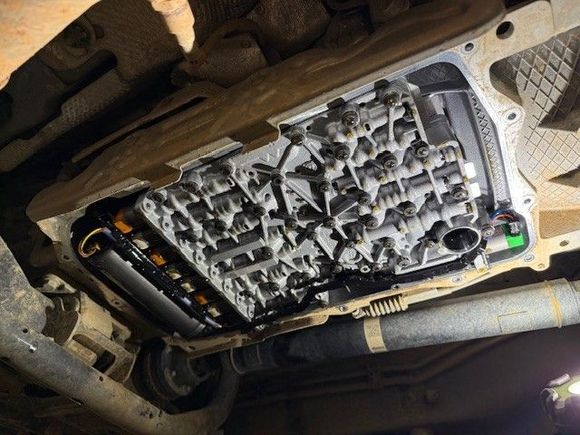 The mechatronics/valve body after all of the ATF has dripped off.