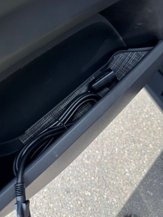 Driver door panel with winch cord. 