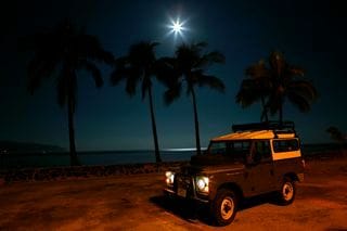 Land Rover Under the full moon in Haleiwa Town on The North Shore of Oahu.