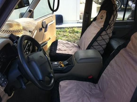 New seat covers from Cabelas.
Not canvas, but damn near close.  Very heavy and well made!