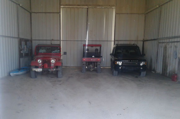 L2R-> Red "Spunky" 1979 CJ-5, chuckwagon, and "Randy" the black 2003 Disco 2 all running in their ranch barn