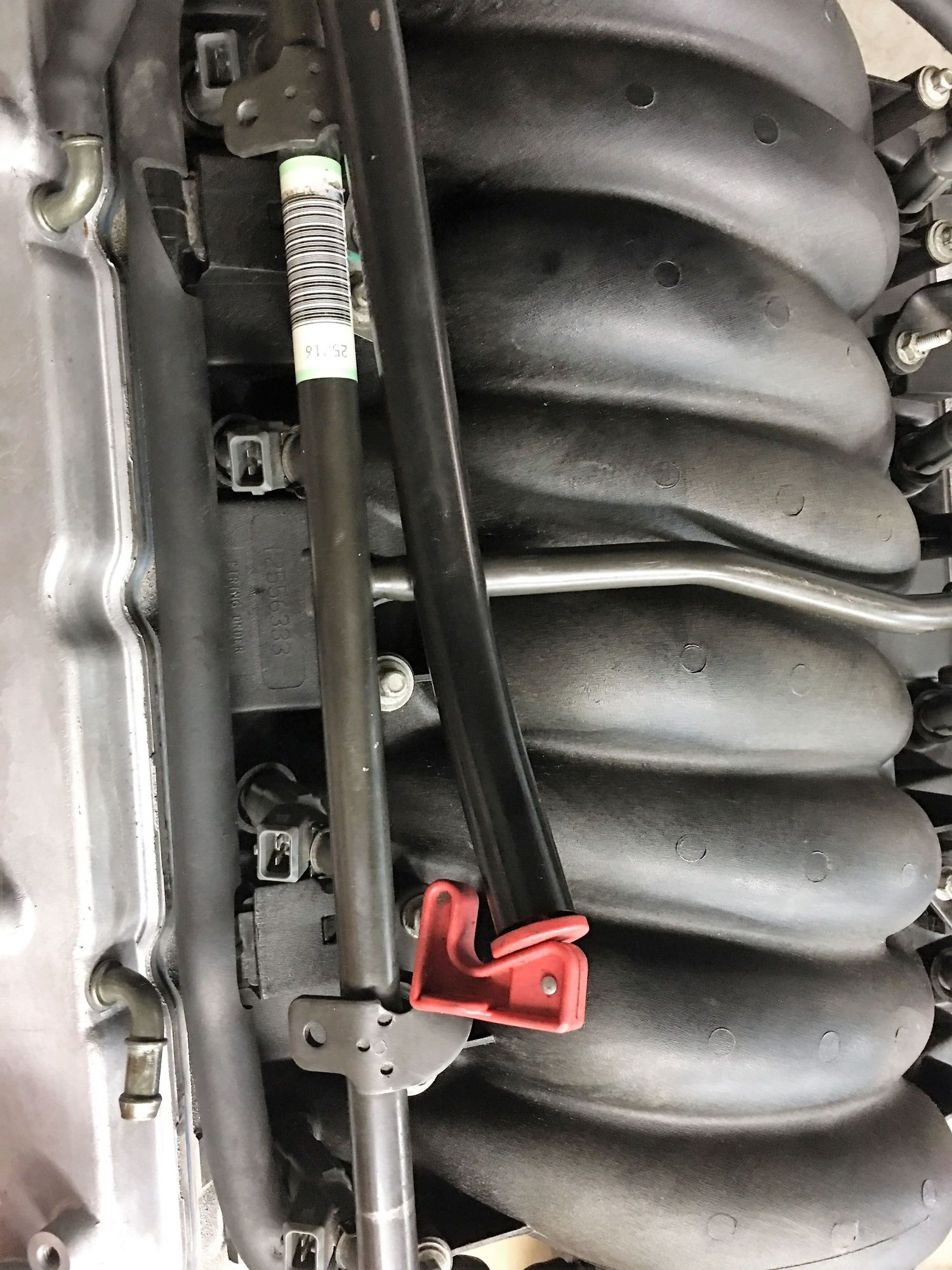 4l60E dipstick tube goes under fuel rail crossover? LS1TECH Camaro