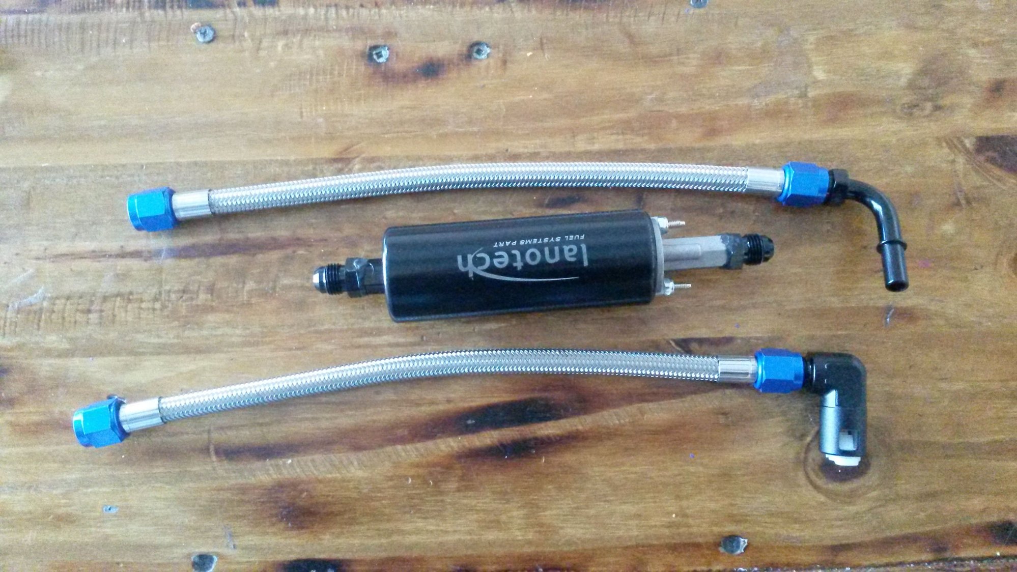 255lph inline walbro style pump with fittings and lines to attach it inline before the fuel filter