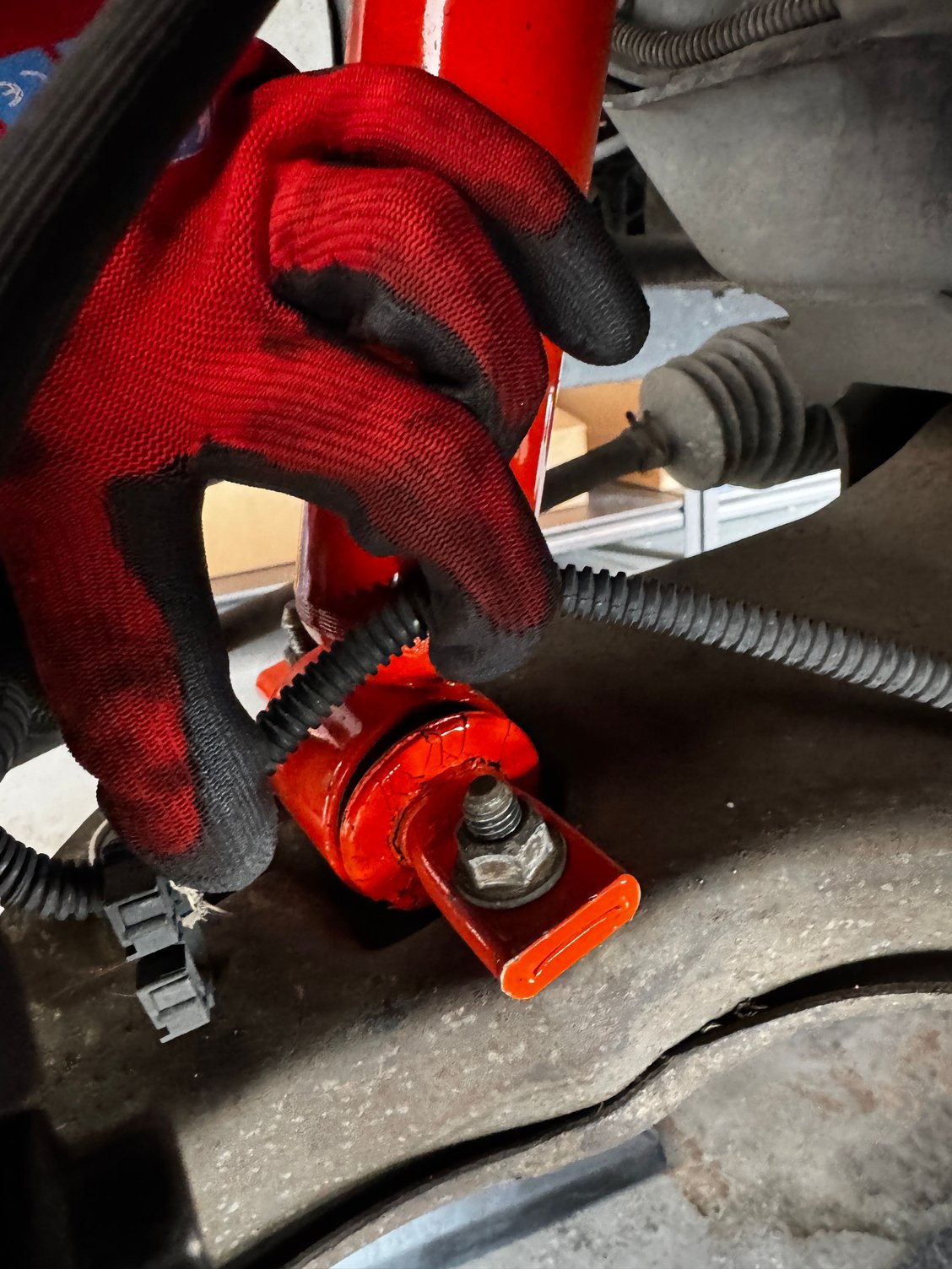 Front Driver Side (rear of shock mount)