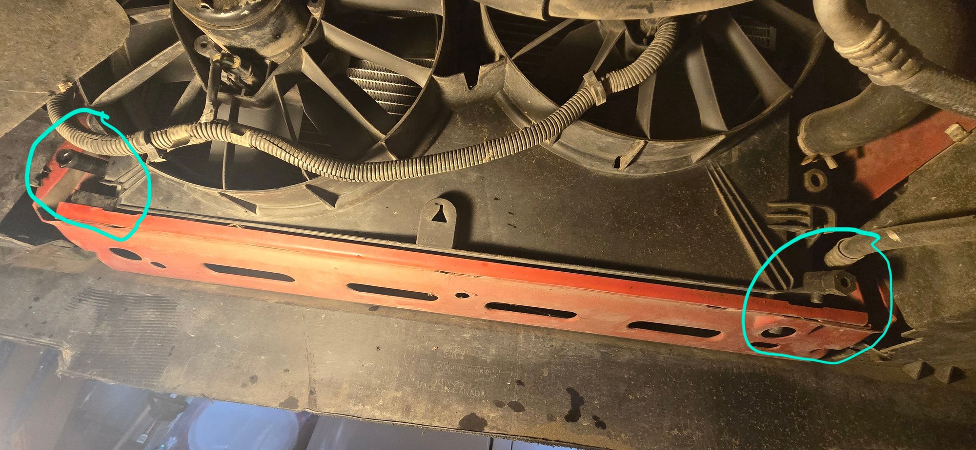Left side is the driver side w/ the blank tube. Right side is passenger side w/ the actual drain petcock. 