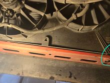 Left side is the driver side w/ the blank tube. Right side is passenger side w/ the actual drain petcock. 