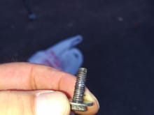 The bolt had been in there for a while because the head is worn down. 