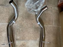 This picture shows the actual tailpipes but there are two more intermediate pipes that go over the rear axle.