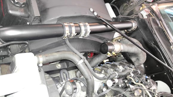 Run hose to pass side valve cover, reuse steam tube holder on radiator hose, as it is now a pcv hose holder.....