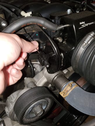 I'm holding the OEM cruise control line. Attaches to the nub just like stock