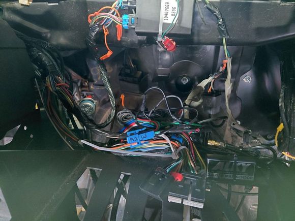 Behind the stereo, most of this wiring runs to the radio or the switch panel in the vent above the radio.
