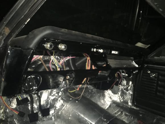 Horrible picture but, the vents are installed and ducting ran. Wiring is started, I have an American autowire kit. Dakota digital gauges. Tomorrow I plan to wire up gauges. It calls for a negative wire ran back to the sender but I think the factory just had a small section of wire clipped to the frame.