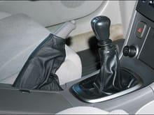 RedlineGoods.com for the leather e-brake boot. Not a perfect match for the shifter boot, but a world better than going commando. It was a glaring design flaw on the 5th Gen interior, not to have a boot around the e-brake.