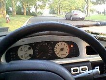 Custom gages, White rpm-(with Bright orange needle) White gas and water temp-(White needle) original black speedometer (Bright orange needel),  and turnsignal light (white). Also volt meter mounted on left just outa pic (pic soon). I did myself I dont think anyone else has anything like this in there maxima which makes mine one of a kind. 120,xxx on odom I think. I snaped the pic right as the security light flashed, owned!