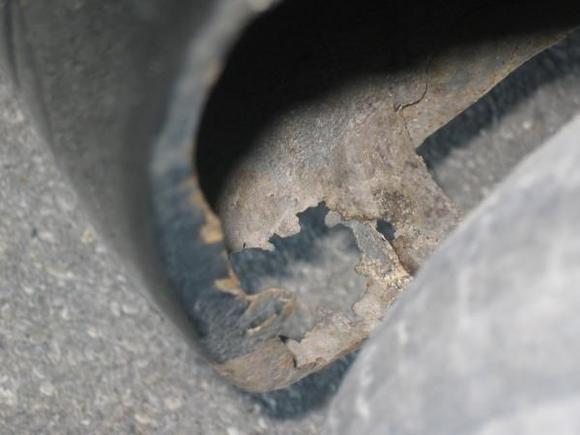 left side rear wheel well hole