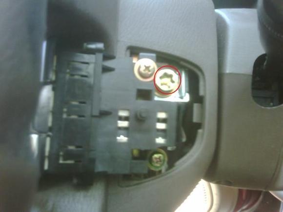 Air bag screw behind cruise control cover