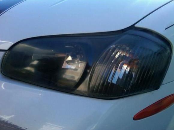 Blacked out headlights.