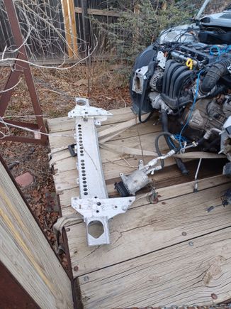 The previous owner purchased a new front "bumper support" -the large aluminum stucture that bolts on to subframe, in front of strut towers.