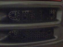 Holes in the bumper right in front of the cold air intake filter allow more air to flow and get to the intake