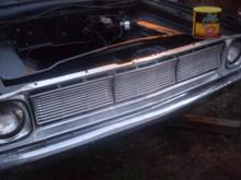 Put the grille and headlight bezels on