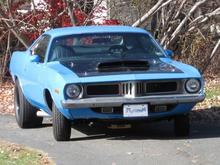 My Petty Blue '73 Cuda. '69 383, 30 over, 509 cam, 590 springs, Edlebrock 800cfm carb and Torker single plane intake, Hooker Comp headers, 4 speed, pistol grip shifter, 355 suregrip, manual steering, heater delete, 15x6 front, 15x10 rear, all welded stainless exhaust with Spintech mufflers, pin-on fiberglass 6 pak hood. Very loud. Fun to drive!