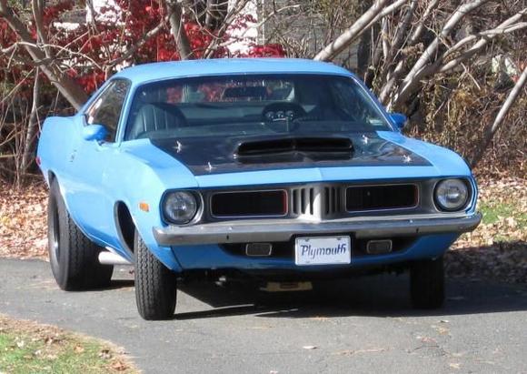 My Petty Blue '73 Cuda. '69 383, 30 over, 509 cam, 590 springs, Edlebrock 800cfm carb and Torker single plane intake, Hooker Comp headers, 4 speed, pistol grip shifter, 355 suregrip, manual steering, heater delete, 15x6 front, 15x10 rear, all welded stainless exhaust with Spintech mufflers, pin-on fiberglass 6 pak hood. Very loud. Fun to drive!