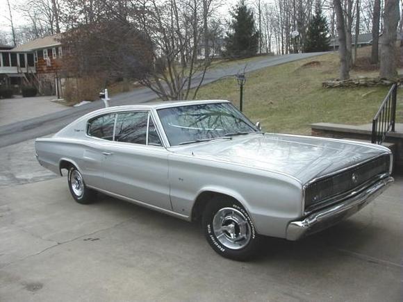 You're looking at the original factory-applied finish. It's faded like silver does, but very good condition for its age.