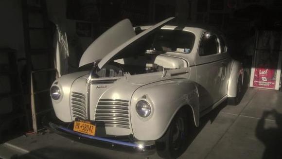 IMAG0654 this is the 1940 p-Plymouth business coupe it is pearl white base coat clear coat  black glass all around  ,with a nice set of chrome wheels and cobra tires nice looking and riding car,