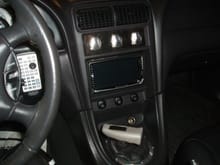 The Tri-Handle shifter, while looking good, isn't very comfortable in my hands personally, so I'm thinking of going to a ball.  You can see in the center the Kenwood in dash DVD headunit, and in the back are two headrest monitors which are connected to the video outputs with their own remotes.