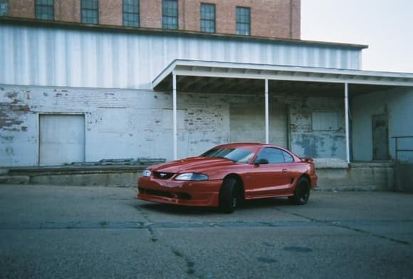 The car with the Y2K front bumper and hood.