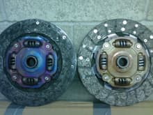 fried OEM clutch disc next to the new one from JWT