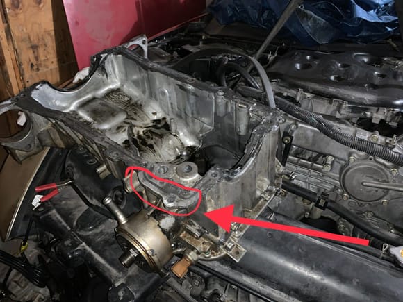 Upper oil pan with location of coolant drip/leak circled