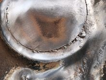 These circles were put in from above and you can see the welds have penetrated through fine but I wanted to go over from below before I l dress them back and paint over.