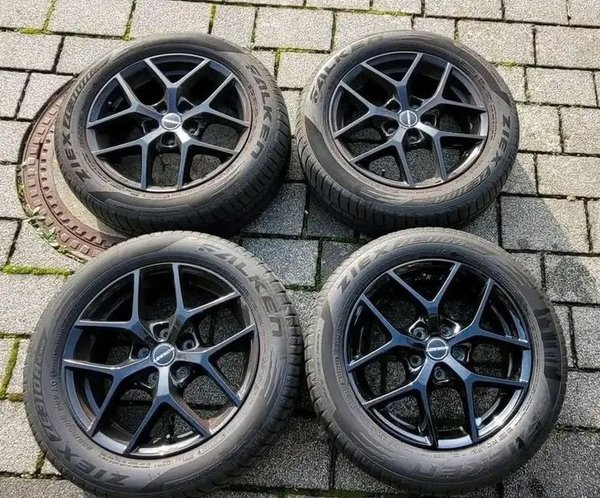 A set of alloy wheels with tires for FORD FOCUS MK3