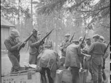 Finns opening crates of the M38 rifles