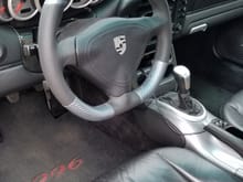 As a final update, here's a picture installed with the airbag from Dallas steering wheels.   I think it looks good with my seal grey center console and carbon fiber trim pieces.   Don at dallas was great to work with and had everything back to me in under a week.  Now i have am extra alcantara airbag cover and module.  Anyone interested?