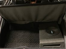 Porsche privacy rear cover.  
Holdown net on floor.  
Subwoofer in enclosure