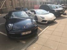 Poor 911 gets no attention when parked next to a hot Italian in Stuttgart