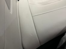 Indention on rear passenger seat - I'm guessing from a baby seat.