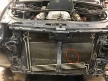 My A/C condenser took a hit requiring me to remove nearly the entire front of the V8 Touareg. Visible the tranny cooler, radiator and condenser outlining where the pebble hit. The clips aligning the three units were a definite PAIN 