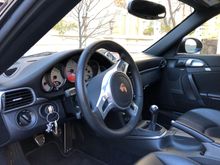 Non OEM steering wheel. Better feel. OEM wheel included.