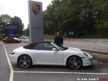Proud buyer in front of Porsche Center