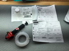 Sample kit with instructions, UPS shipping label and envelope.  The pump and tubing are for engines with dipstick tubes, shown for illustration only, not usable for my car.