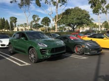 Macan in British Racing Green next to a GT4 Brewster Green.